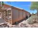 Exterior of the home showing the sunroom and covered patio in the backyard at 1563 E Peregrine Trl, Casa Grande, AZ 85122