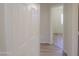 Hallway view into a room featuring modern flooring and lots of light at 1563 E Peregrine Trl, Casa Grande, AZ 85122