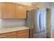 Stainless steel refrigerator and spacious pantry in a well-organized kitchen space at 1563 E Peregrine Trl, Casa Grande, AZ 85122