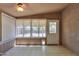 Bright sunroom with tile flooring, fan, and multiple windows at 1563 E Peregrine Trl, Casa Grande, AZ 85122