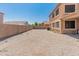 Back yard featuring low-maintenance landscaping and block wall fencing for enhanced privacy at 15985 W Bartlett Ave, Goodyear, AZ 85338