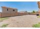 A well-maintained backyard, enclosed with block wall fencing, offers privacy and minimal upkeep at 15985 W Bartlett Ave, Goodyear, AZ 85338
