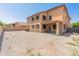 The expansive backyard showcases a low-maintenance design with block wall fencing, perfect for outdoor living at 15985 W Bartlett Ave, Goodyear, AZ 85338