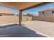 Back yard features a low-maintenance landscape, block wall fencing, and ample privacy at 15985 W Bartlett Ave, Goodyear, AZ 85338