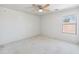 Bedroom featuring a ceiling fan, a window, and carpeted floors at 15985 W Bartlett Ave, Goodyear, AZ 85338