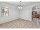 Sunny dining room with a window and tile flooring, ideal for Gathering meals at 15985 W Bartlett Ave, Goodyear, AZ 85338