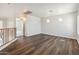 Upper hallway featuring wood floors and access to other rooms at 15985 W Bartlett Ave, Goodyear, AZ 85338