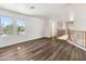 Upstairs open space with wood floors and large windows at 15985 W Bartlett Ave, Goodyear, AZ 85338