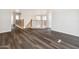 Open hallway space featuring wood flooring and a decorative railing at 15985 W Bartlett Ave, Goodyear, AZ 85338