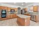 Kitchen featuring stainless appliances, granite counters, and a central island at 15985 W Bartlett Ave, Goodyear, AZ 85338