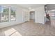Bright living room featuring tile flooring and a front door at 15985 W Bartlett Ave, Goodyear, AZ 85338