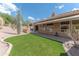 Private backyard with manicured lawn and covered patio, perfect for outdoor enjoyment at 16436 S 1St Ave, Phoenix, AZ 85045