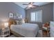 Cozy bedroom featuring a ceiling fan and white shuttered window for a relaxing private space at 16436 S 1St Ave, Phoenix, AZ 85045
