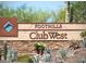 Community sign for Foothills Club West with desert plants in the foreground at 16436 S 1St Ave, Phoenix, AZ 85045