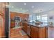 Gourmet kitchen featuring wooden cabinets, stainless steel appliances, and a granite island at 16436 S 1St Ave, Phoenix, AZ 85045