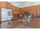 Beautiful kitchen showcasing wood cabinets, granite counters, and stainless appliances at 16436 S 1St Ave, Phoenix, AZ 85045