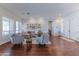 Spacious living room featuring hardwood floors, bright windows, and comfortable seating arrangements at 16436 S 1St Ave, Phoenix, AZ 85045