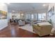 Open-concept living space with hardwood floors, neutral decor, and seamless flow to the dining area at 16436 S 1St Ave, Phoenix, AZ 85045
