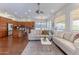 Open floor plan showcasing a kitchen with an island, a dining area, and a bright living space at 16436 S 1St Ave, Phoenix, AZ 85045
