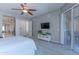 Bright main bedroom with carpet, tv, ceiling fan, and ensuite access at 16436 S 1St Ave, Phoenix, AZ 85045