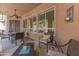 Cozy covered patio with dining area, seating, and view of well-maintained backyard at 16436 S 1St Ave, Phoenix, AZ 85045