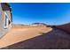 Spacious backyard area ready for landscaping, featuring a block wall for added privacy at 16455 W Avenida Del Sol --, Surprise, AZ 85387