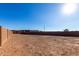 Spacious backyard area ready for landscaping, featuring a block wall for added privacy at 16455 W Avenida Del Sol --, Surprise, AZ 85387