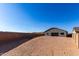 The backyard showcasing ample space for landscaping, featuring a house view and block perimeter wall at 16455 W Avenida Del Sol --, Surprise, AZ 85387