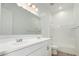 Bathroom features a double-sink vanity, a mirror, and a shower-tub at 16455 W Avenida Del Sol --, Surprise, AZ 85387