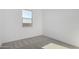 Bright bedroom features a double-paned window and neutral colored carpet at 16455 W Avenida Del Sol --, Surprise, AZ 85387