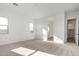Sunlit bedroom with an open doorway leading to a view of the ensuite bathroom at 16455 W Avenida Del Sol --, Surprise, AZ 85387