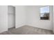 Bedroom features a walk-in closet and a single double-paned window at 16455 W Avenida Del Sol --, Surprise, AZ 85387