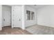 Neutral room with new carpet, white walls, and two sunny windows at 16455 W Avenida Del Sol --, Surprise, AZ 85387