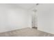 Bright bedroom features neutral carpet, light walls, and an en-suite bathroom at 16455 W Avenida Del Sol --, Surprise, AZ 85387