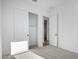 Bedroom features a walk-in closet with a sliding door and neutral carpet at 16455 W Avenida Del Sol --, Surprise, AZ 85387
