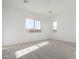 A bedroom filled with natural light and gray carpeting for comfort and style at 16455 W Avenida Del Sol --, Surprise, AZ 85387