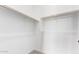 Walk-in closet provides ample storage with modern rod and shelving at 16455 W Avenida Del Sol --, Surprise, AZ 85387