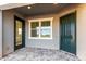 Inviting entryway with a stylish door, large window for natural light, and a neutral color scheme at 16455 W Avenida Del Sol --, Surprise, AZ 85387