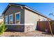 Charming home featuring neutral stucco, stone accents, and well-placed windows for plenty of natural light at 16455 W Avenida Del Sol --, Surprise, AZ 85387