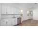 This kitchenette features plenty of cabinets, granite countertops, and a mini fridge at 16455 W Avenida Del Sol --, Surprise, AZ 85387