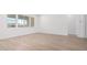 Open living area showcases wood-look tile flooring and large windows at 16455 W Avenida Del Sol --, Surprise, AZ 85387