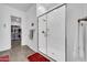 Bright bathroom features a glass shower, modern fixtures, and a walk-in closet at 17003 W Alameda Rd, Surprise, AZ 85387