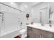 Cozy bathroom features a shower/tub combo with vanity and modern fixtures at 17003 W Alameda Rd, Surprise, AZ 85387