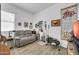 Bonus room features wood-look tile flooring and a comfortable sitting area at 17003 W Alameda Rd, Surprise, AZ 85387