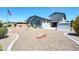 Exterior view showing three car garage, storage shed and low maintenance yard at 17003 W Alameda Rd, Surprise, AZ 85387