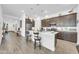 Modern kitchen with a large island, stainless steel appliances, and plenty of counter space at 17003 W Alameda Rd, Surprise, AZ 85387