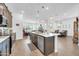 Open kitchen featuring an island, stainless steel appliances, and lots of cabinet space at 17003 W Alameda Rd, Surprise, AZ 85387