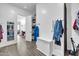 Spacious mud room entrance with wood-look tile flooring and built-in storage bench at 17003 W Alameda Rd, Surprise, AZ 85387