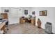 Office space features two desks, wood-look tile flooring, and neutral walls at 17003 W Alameda Rd, Surprise, AZ 85387