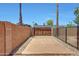 Gated backyard with concrete slab and gravel accents at 1712 E Manhatton Dr, Tempe, AZ 85282